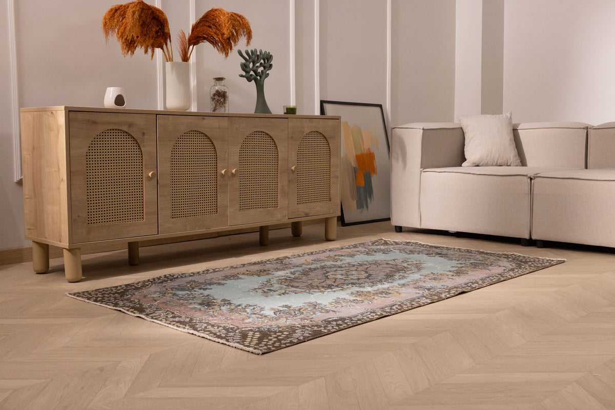 Vintage 3x6 ft Isparta wool and cotton rug in brown and gray with intricate floral patterns in a modern living room.