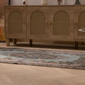 Vintage 3x6 ft Isparta Turkish wool rug with brown and gray floral patterns on a wooden floor.