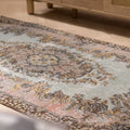 Vintage 3x6 ft Isparta Turkish rug in brown and gray with intricate floral patterns, hand-woven in wool and cotton.