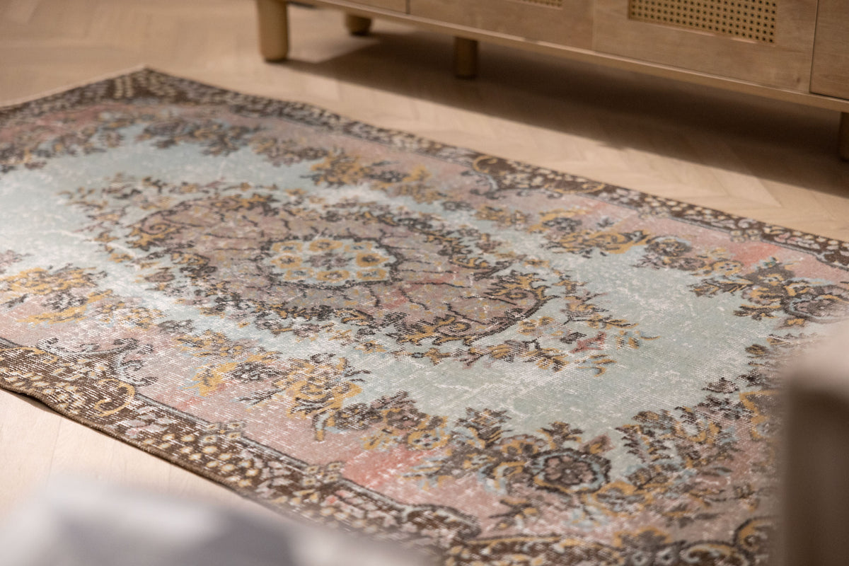 Vintage 3x6 ft Isparta Turkish rug in brown and gray with intricate floral patterns, hand-woven in wool and cotton.