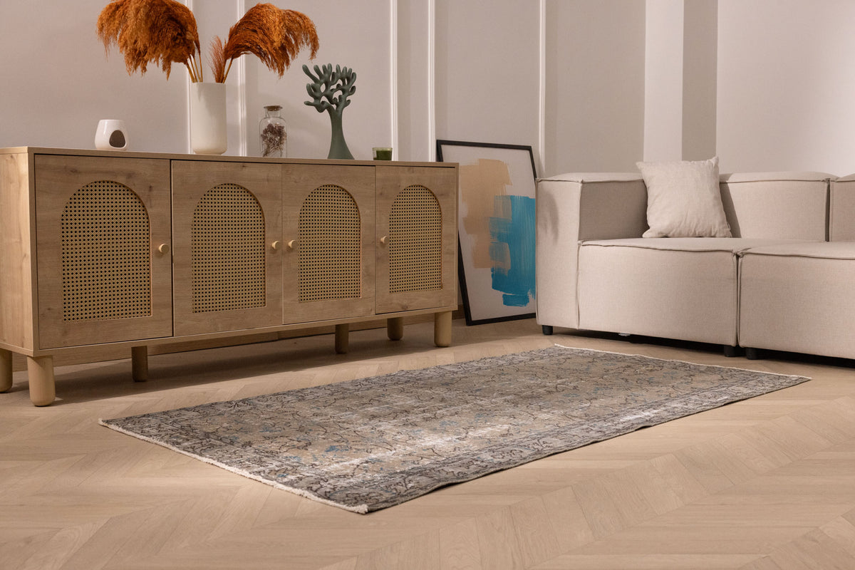 Hand-woven 3x7 ft vintage Isparta Turkish rug featuring intricate floral patterns in muted orange tones on a low-pile wool blend.
