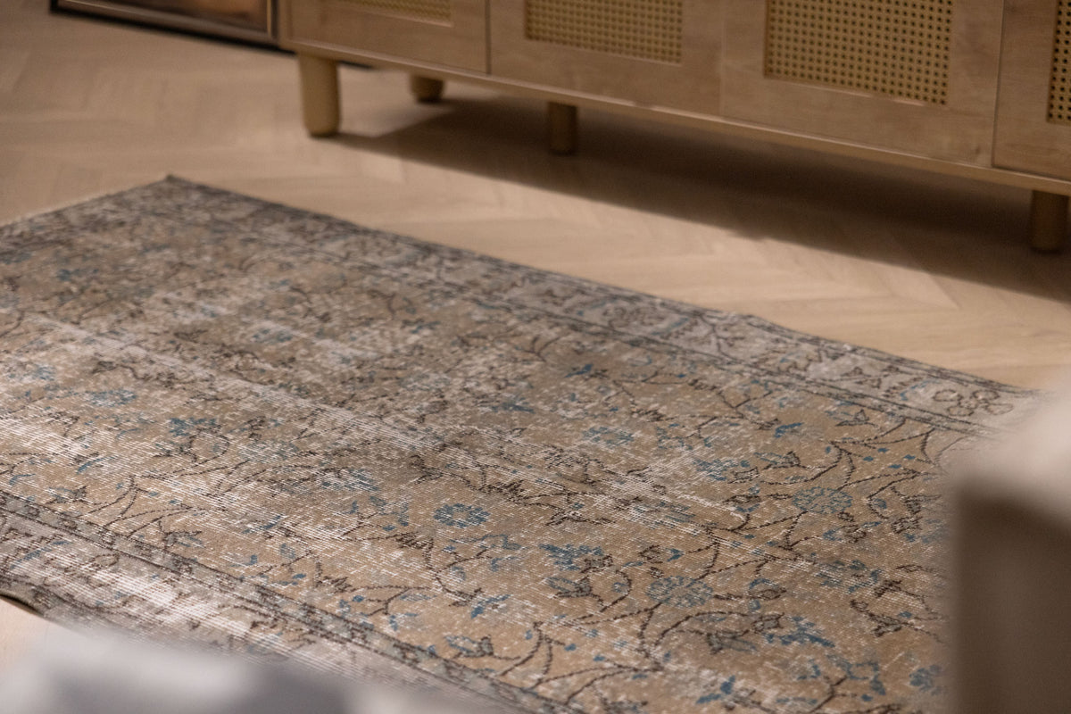 Vintage 3x7 ft hand-woven Isparta rug in burnt orange with intricate floral patterns and a soft, low-pile wool-cotton blend.