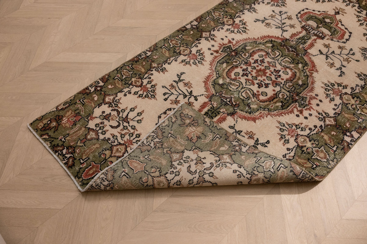 Hand-woven vintage Isparta rug in white and sage green with floral maximalist patterns, 3.5x6.6 ft wool and cotton blend.