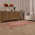 Vintage pink overdyed Turkish area rug with floral patterns, hand-woven in wool and cotton, 3x6 ft size.