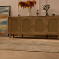 Vintage 4x7 ft handmade Turkish area rug in gray and brown with intricate floral patterns on a wooden floor.