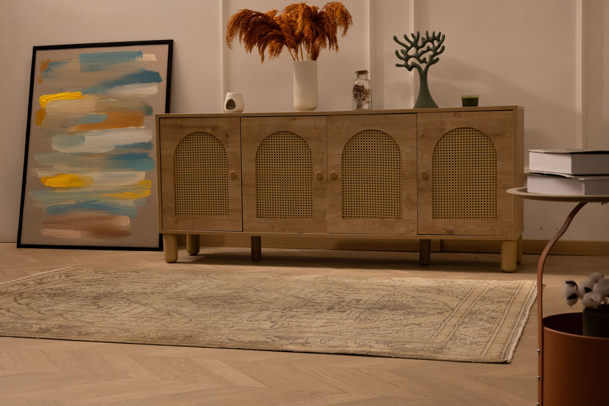 Vintage 4x7 ft handmade Turkish area rug in gray and brown with intricate floral patterns on a wooden floor.