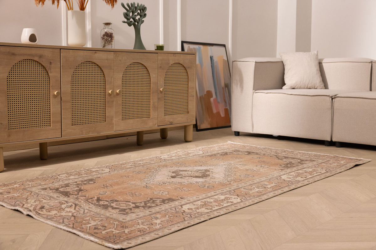 Vintage 4x7 ft brown floral Isparta Turkish wool and cotton rug with intricate maximalist patterns in a living room.