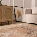 Hand-woven 4x7 ft vintage Isparta rug in earthy brown with intricate floral patterns and a low pile wool-cotton blend.