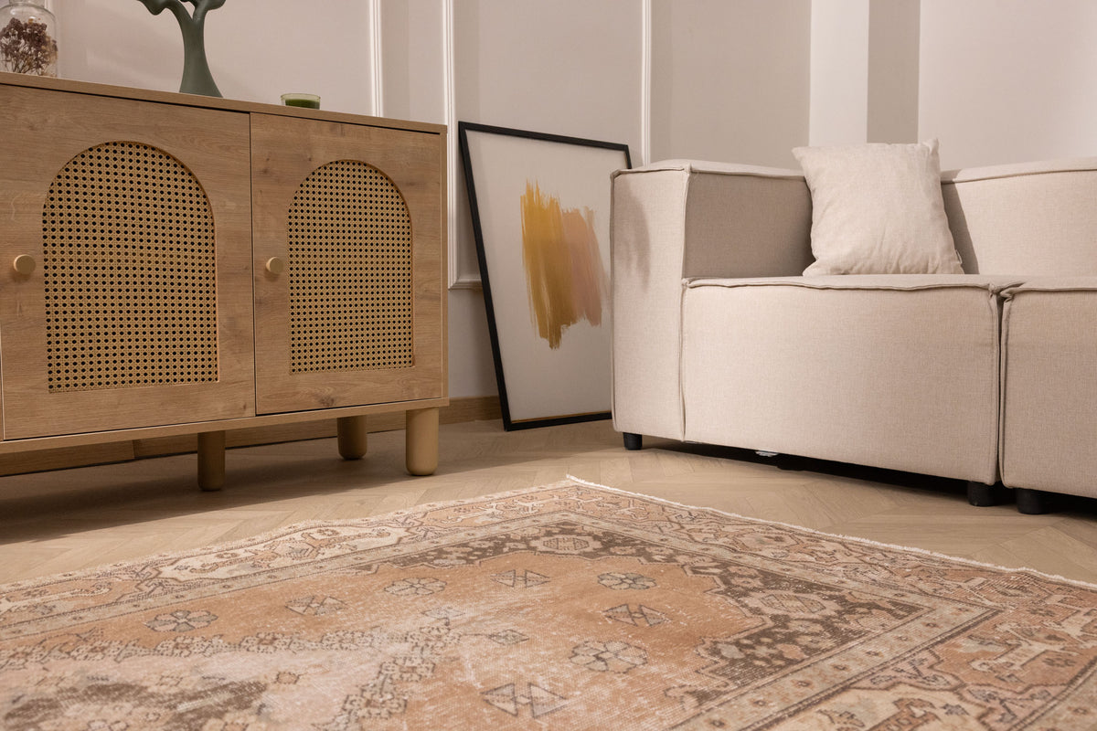 Hand-woven 4x7 ft vintage Isparta rug in earthy brown with intricate floral patterns and a low pile wool-cotton blend.