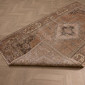 Vintage 4x7 ft hand-woven Isparta wool and cotton rug in earthy brown with maximalist floral patterns.