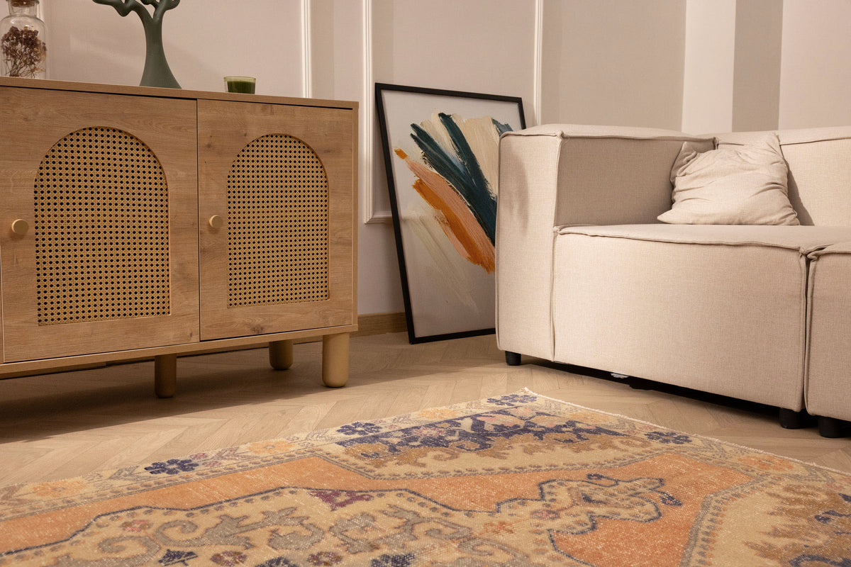 Hand-woven vintage Turkish area rug in orange and beige with a floral medallion design, 4x7 ft wool and cotton blend.