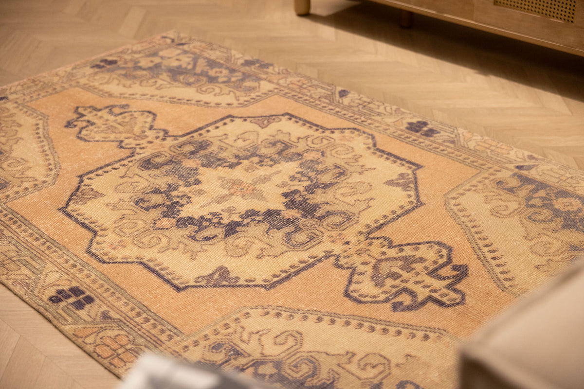 Vintage Nevşehir Turkish Area Rug 4x7 ft — Orange & Navy Medallion