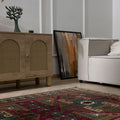 Hand-woven 4x6 vintage Turkish Kars wool rug featuring geometric patterns in rich red and brown tones.