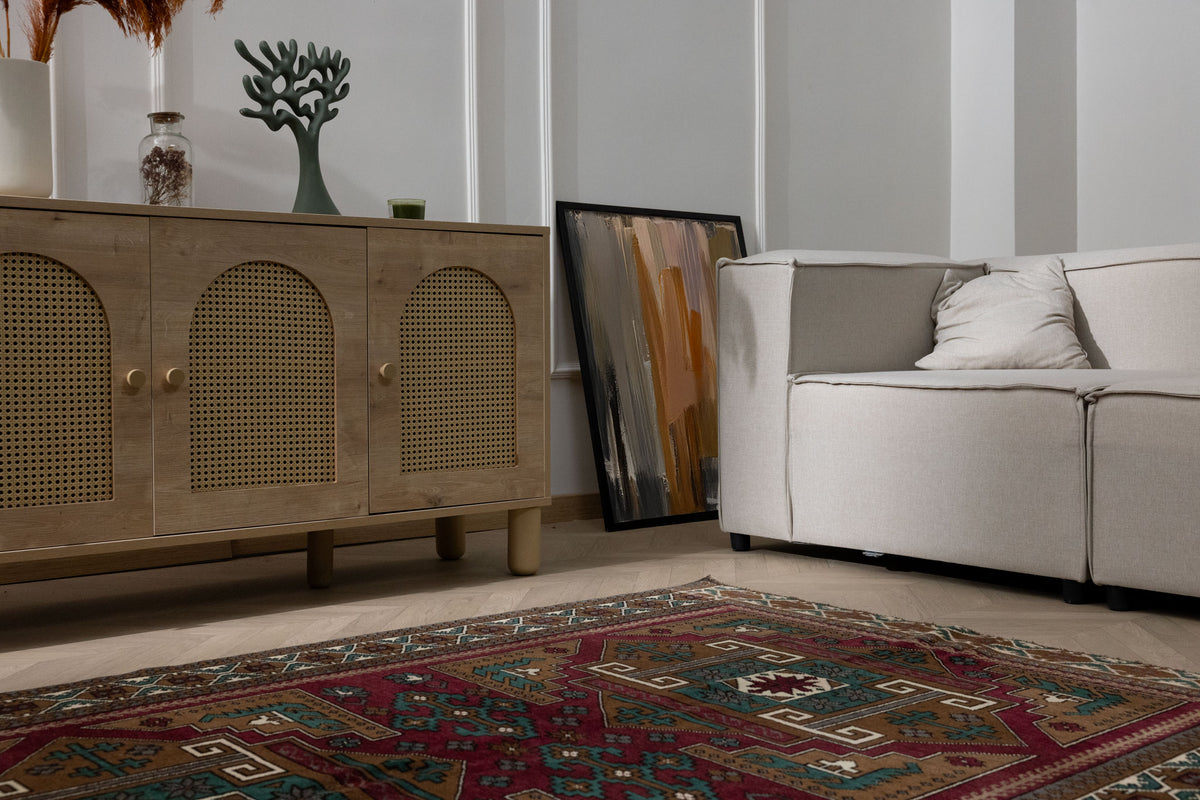 Hand-woven 4x6 vintage Turkish Kars wool rug featuring geometric patterns in rich red and brown tones.