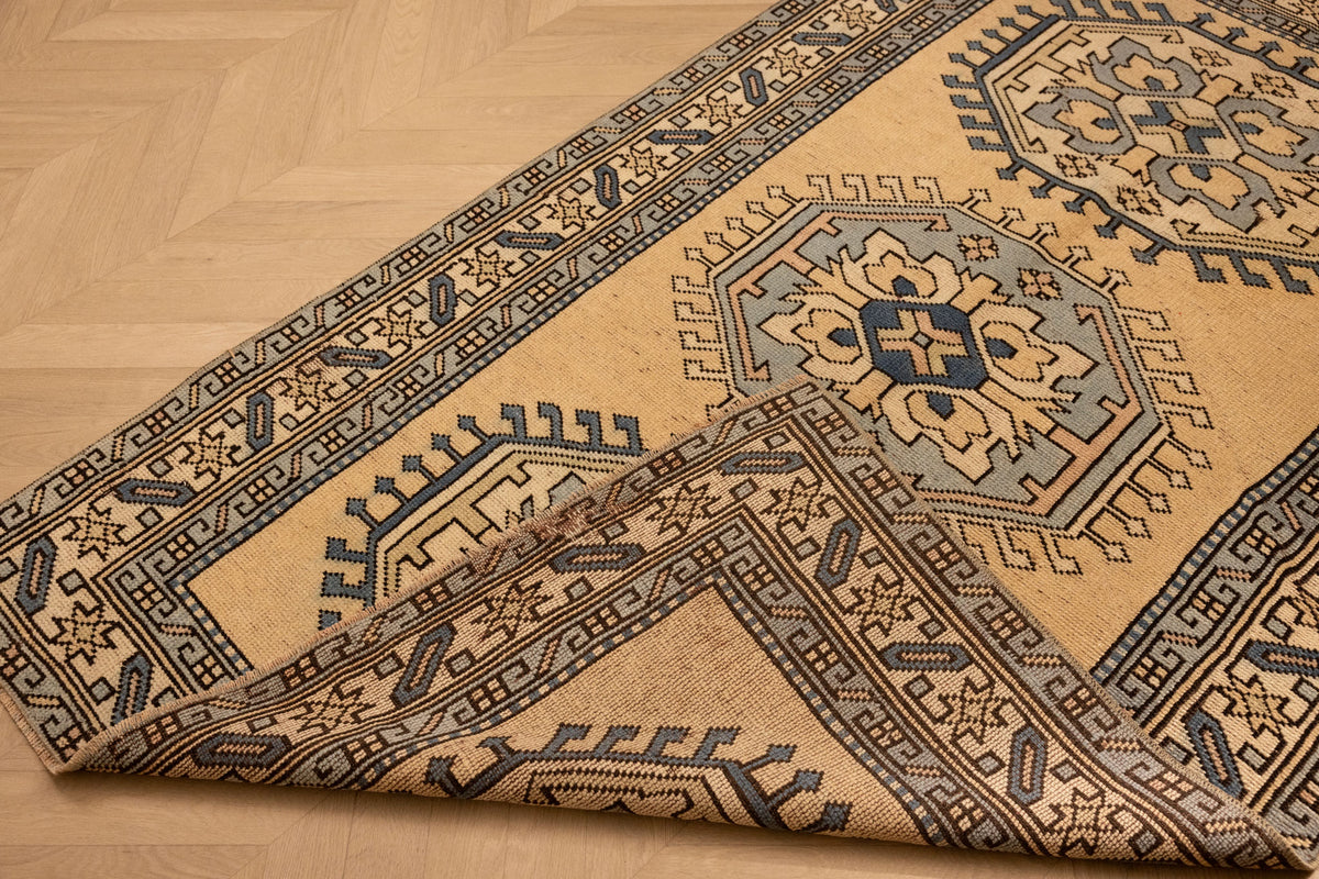 Hand-woven vintage Oushak wool rug in beige and navy with traditional geometric patterns, 3x6 ft.