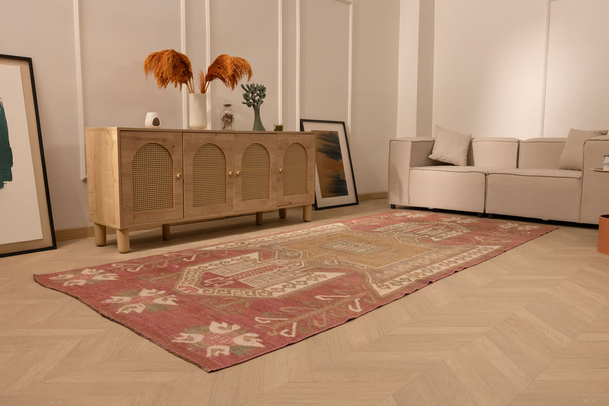 Handwoven vintage Turkish runner rug in red and pink with geometric patterns, 4x11 ft wool and cotton blend.