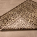 Hand-woven 1x3 ft vintage Isparta wool and cotton rug in beige and brown with intricate maximalist floral patterns.