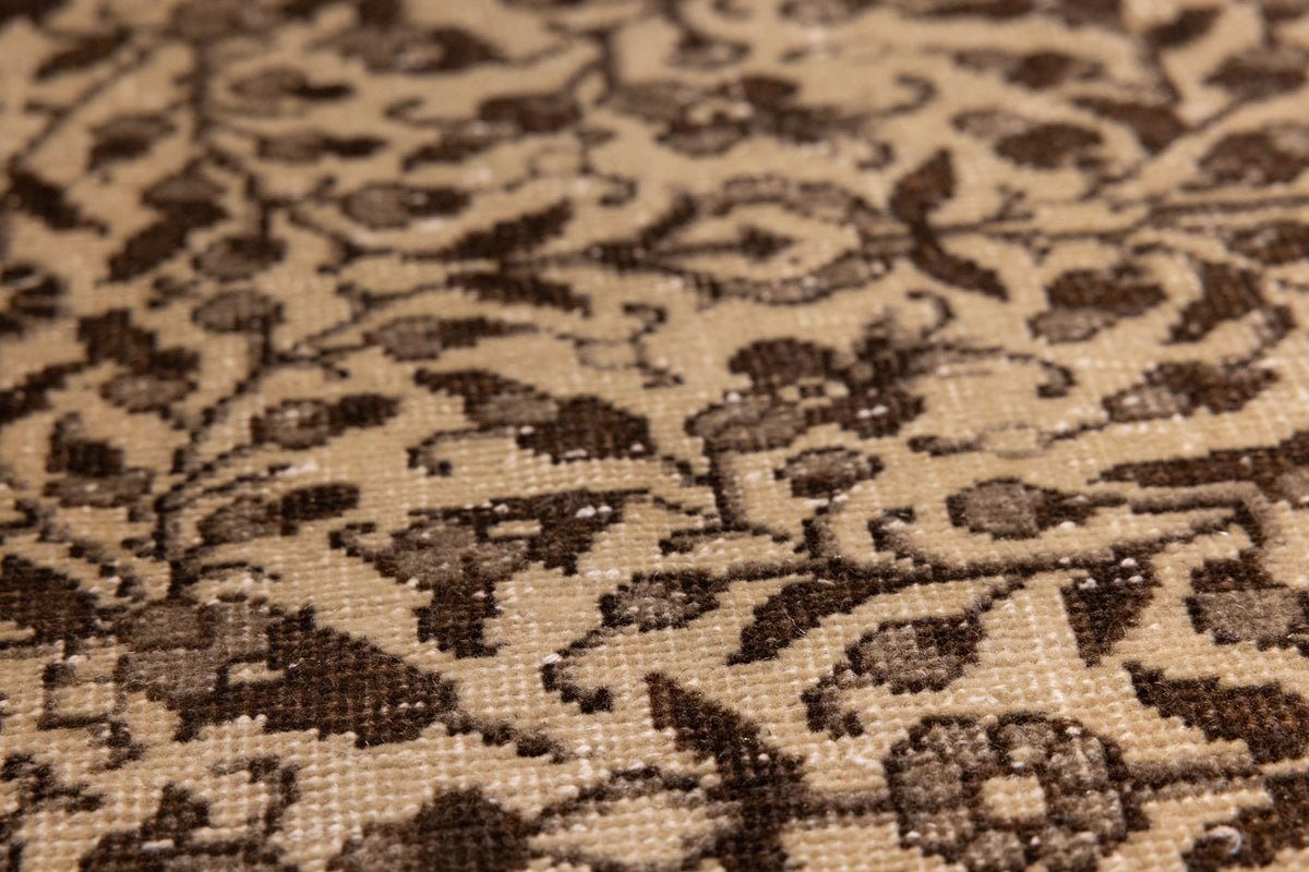 Hand-woven vintage Isparta rug in beige and brown with intricate floral patterns and a textured wool-cotton blend.