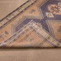 Vintage 4x12 ft Turkish runner rug in orange and navy wool with geometric tribal patterns on a hardwood floor.
