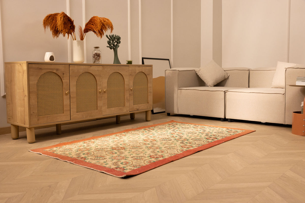 Hand-woven vintage Isparta rug in white and red with floral patterns, 2x12 ft wool and cotton runner in a modern living room.