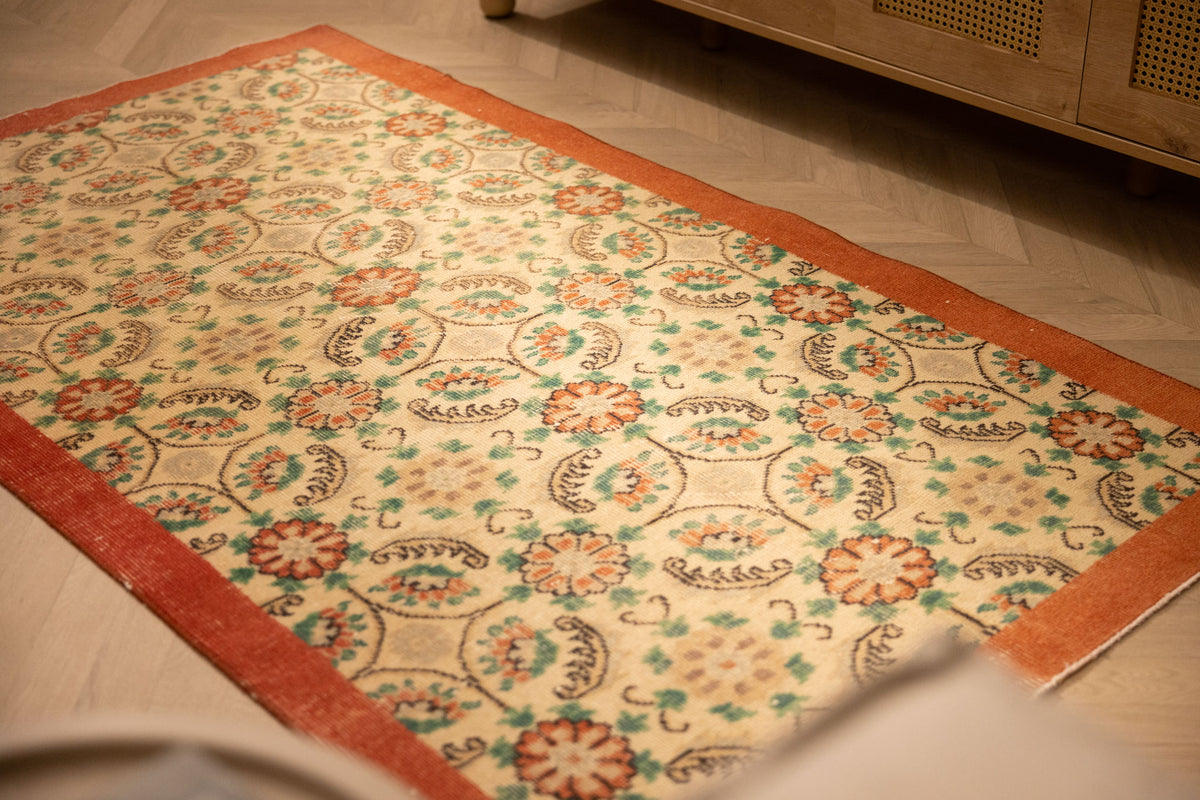 Hand-woven vintage Isparta Turkish runner rug with red and white floral patterns in wool and cotton.
