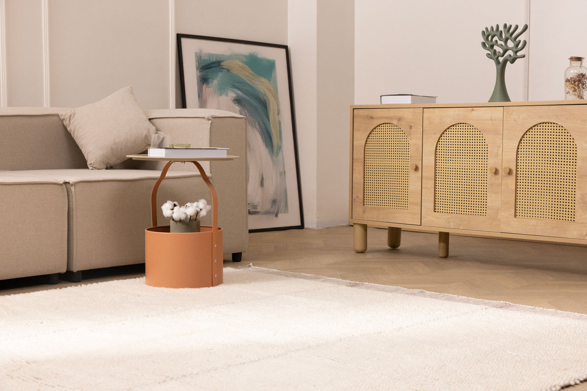 Handwoven brown shaggy wool rug with a thick, soft pile texture in a cozy, modern living room setting.
