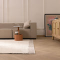 Luxurious brown shaggy wool rug with a thick, soft pile texture in a modern, cozy living room setting.
