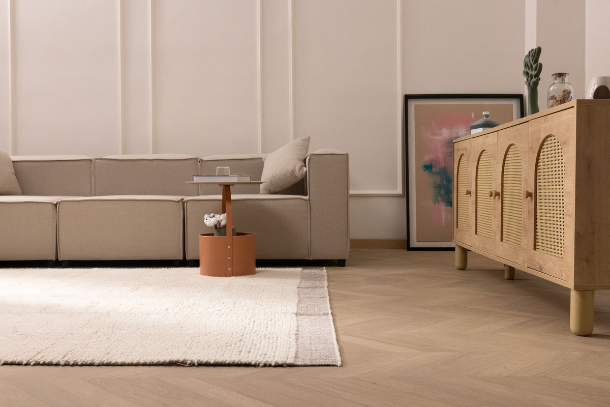 Luxurious brown shaggy wool rug with a thick, soft pile texture in a modern, cozy living room setting.