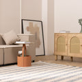 Handwoven white and blue striped wool-blend flatweave rug in a modern living room setting.