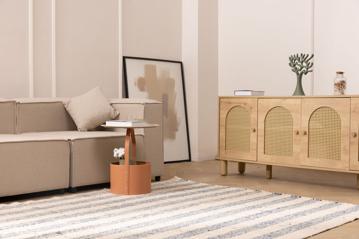 Handwoven white and blue striped wool-blend flatweave rug in a modern living room setting.
