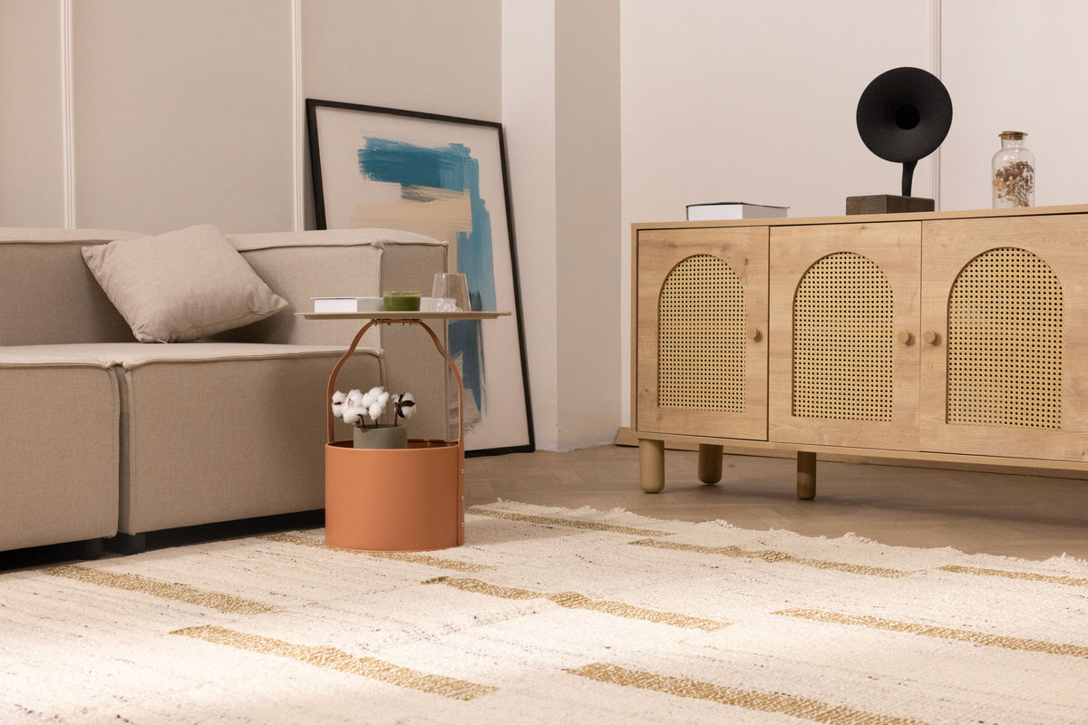 Handwoven white and brown wool-blend flatweave rug with a textured striped pattern in a modern living room setting.