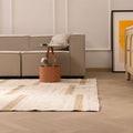 Handwoven white and brown wool-cotton flatweave rug with a geometric pattern in a modern living room.