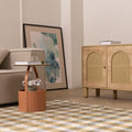 Handwoven white, brown, and blue checkered wool-blend flatweave rug in a modern living room setting.