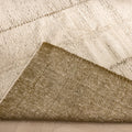 Handwoven army green and cream shaggy wool rug with a thick, textured pile and durable cotton-blend backing.