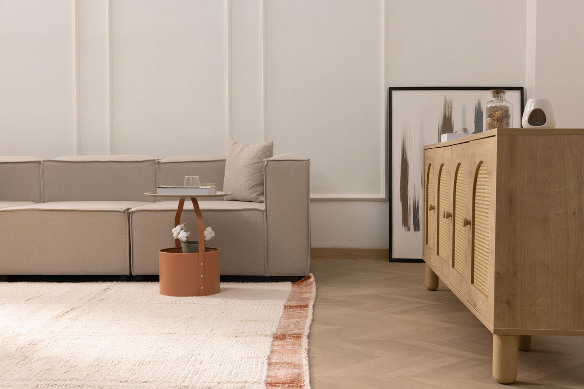 Terracotta and cream shaggy wool rug with a high pile texture in a modern, cozy living room setting.