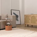 Handwoven dark mustard shaggy wool rug with a thick, soft pile texture in a modern, cozy living room setting.