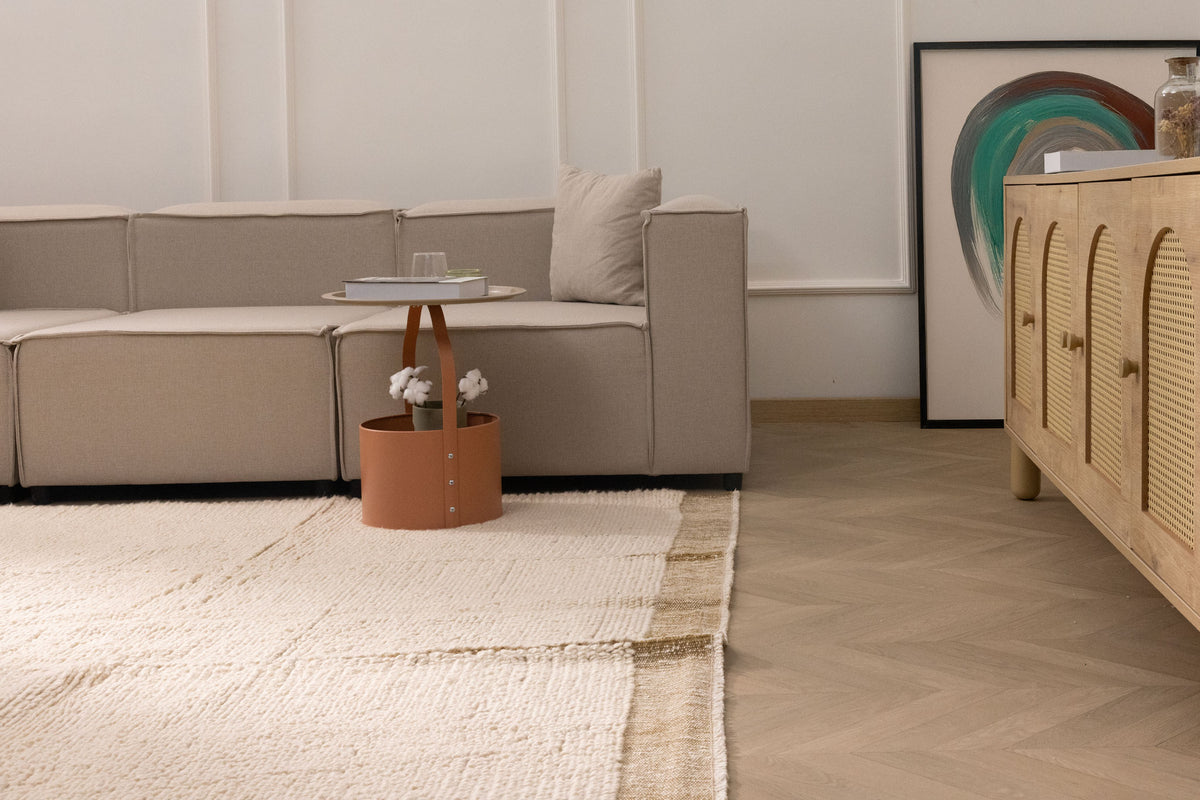 Handwoven dark mustard shaggy wool rug with a thick, textured pile in a modern living room setting.