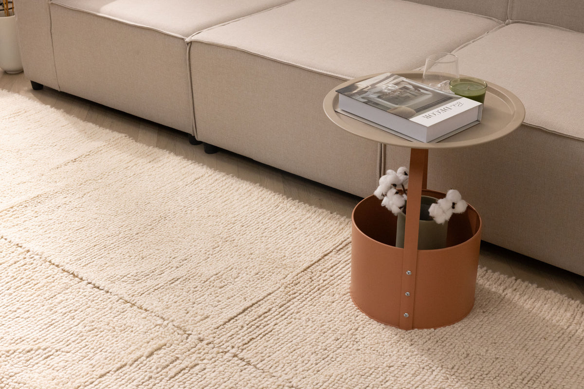 Handwoven dark mustard shaggy wool rug with a thick, textured pile placed in a cozy living room setting.