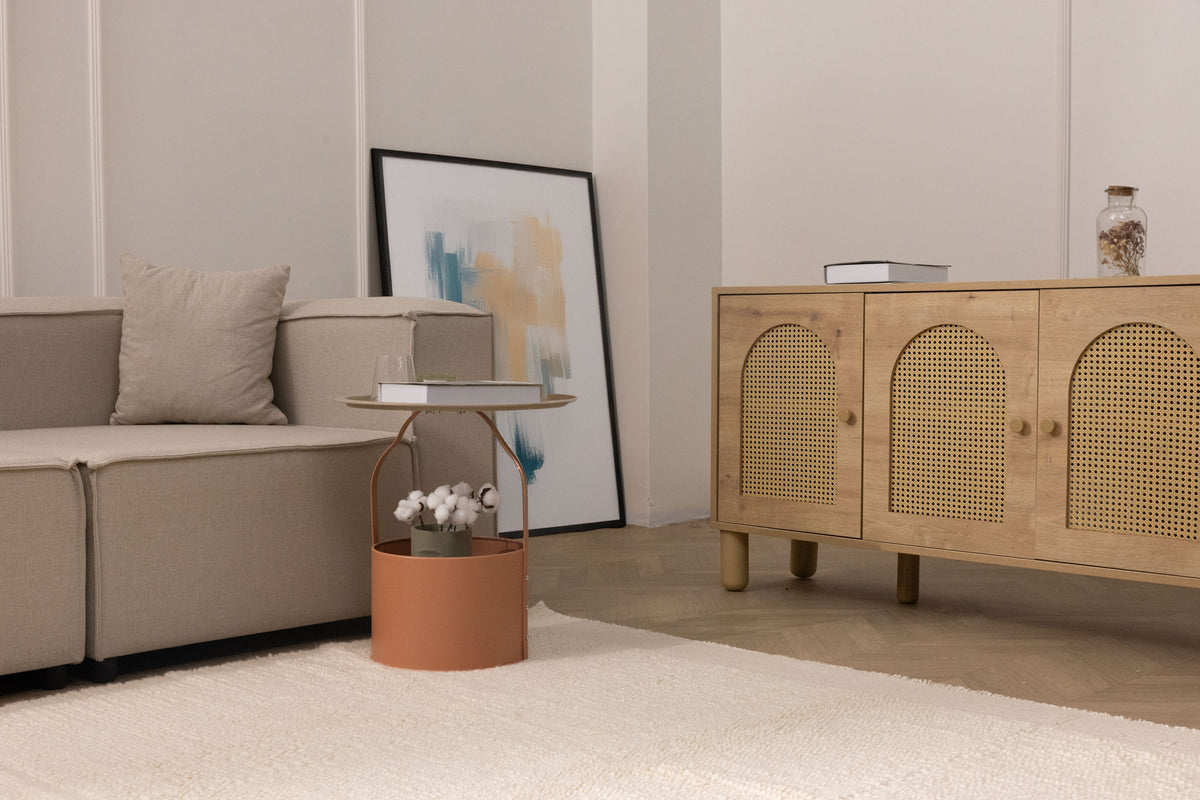 Handwoven white shaggy wool area rug with a thick, soft pile texture in a cozy, modern living room setting.