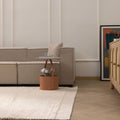 Luxurious white shaggy wool rug with a thick, soft texture in a modern, cozy living room setting.