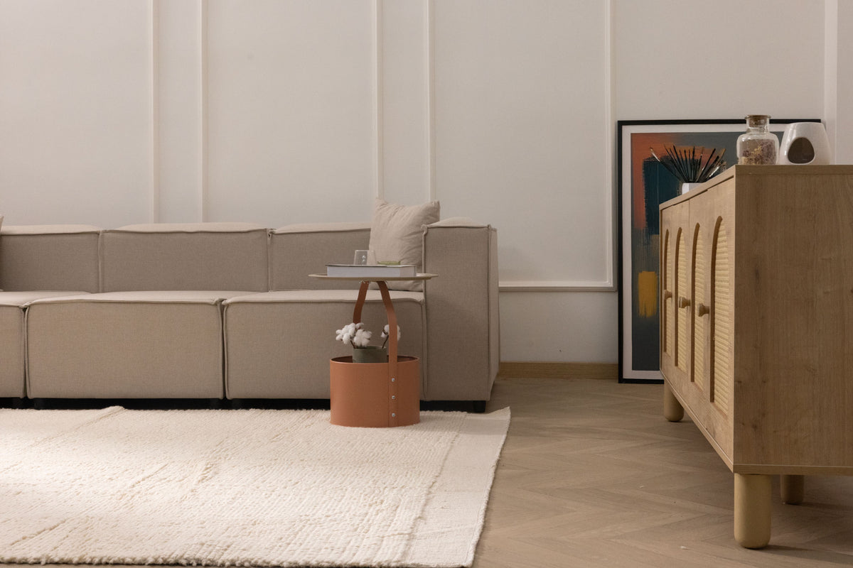 Luxurious white shaggy wool rug with a thick, soft texture in a modern, cozy living room setting.
