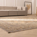 Oversized wool and cotton Persian-style area rug in brown and green floral patterns in a modern farmhouse living room.