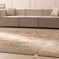 Oversized Persian-style wool and cotton area rug in brown and green floral patterns in a modern farmhouse living room.