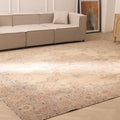 Oversized beige Persian-style wool and cotton rug with intricate floral motifs in a traditional bohemian living room.