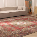 Oversized red and white Persian-style wool-cotton rug with intricate floral patterns in a modern living room setting.