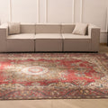 Oversized red and white Persian-style wool and cotton area rug with intricate floral motifs in a living room setting.
