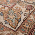 Handmade wool and cotton Persian-style rug with intricate red, white, and floral maximalist patterns.