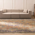 Oversized Persian-style wool and cotton rug featuring orange and navy floral patterns in a traditional bohemian design.