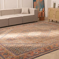 Oversized brown Persian-style wool and cotton rug with intricate floral patterns in a traditional living room.