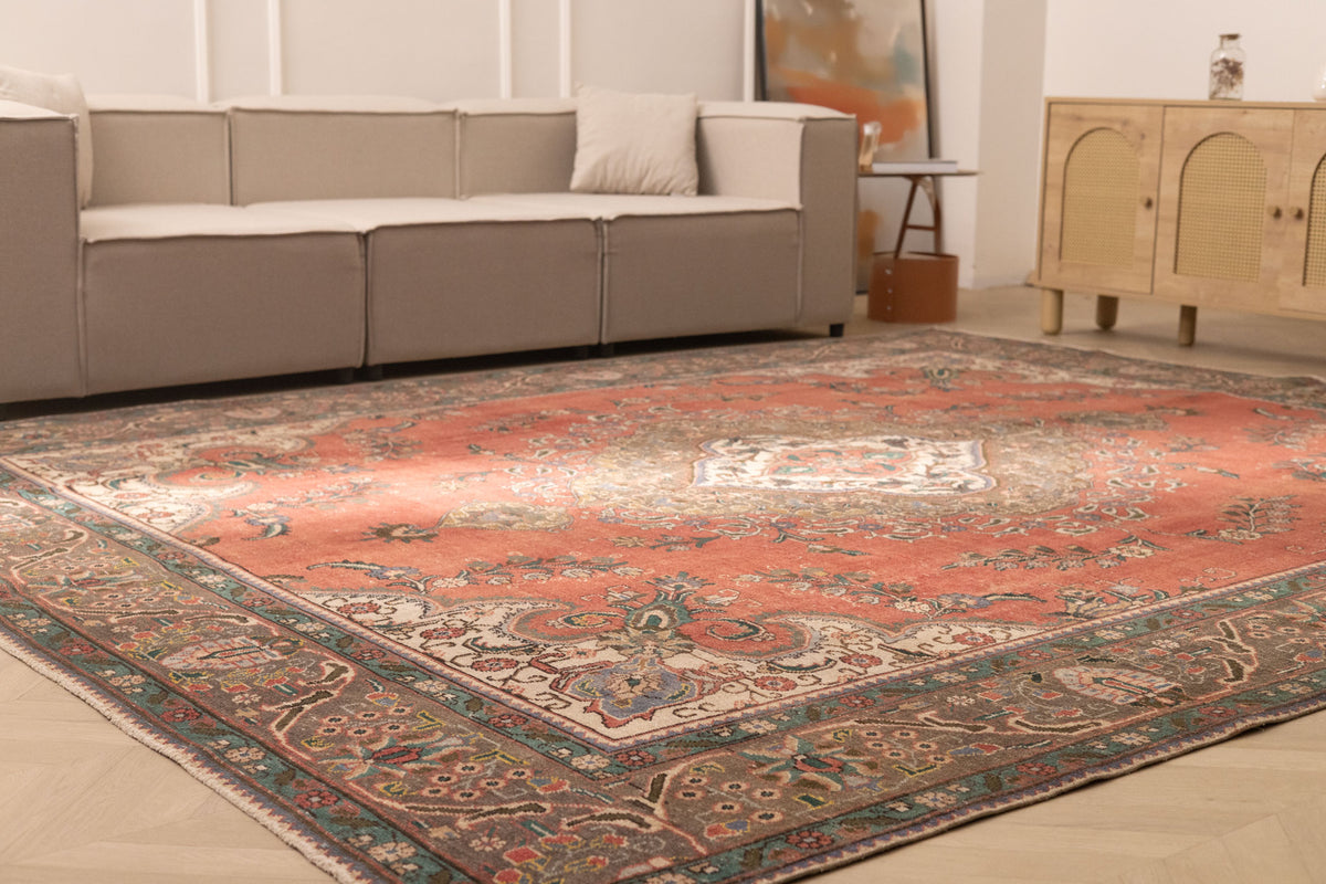 Oversized 9.7x12.1 ft handmade wool and cotton Persian rug featuring a red floral pattern in a traditional bohemian style.